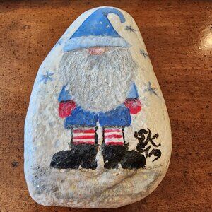 Christmas Holiday Gnome in Blue Santa Outfit with Snow Sparkles on a River Rock